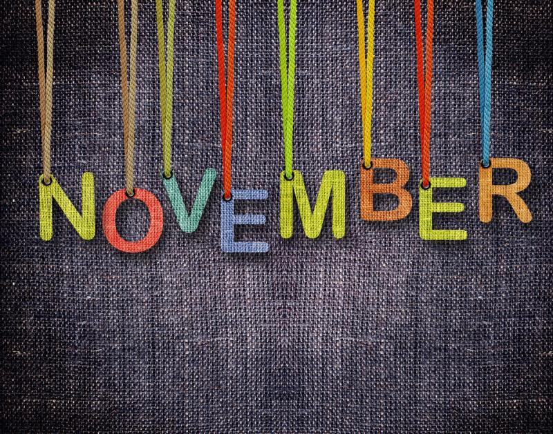 November letters hanging strings with blue sackcloth background. Black Month